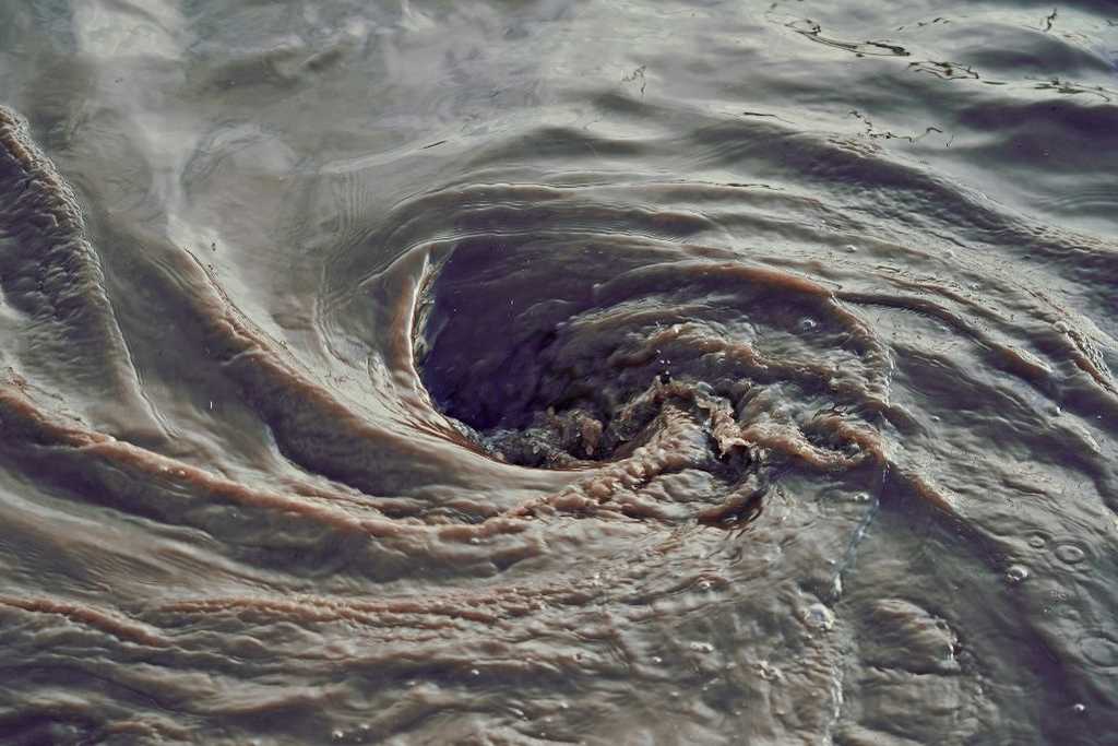 water swirling in the shape of a whirlpool